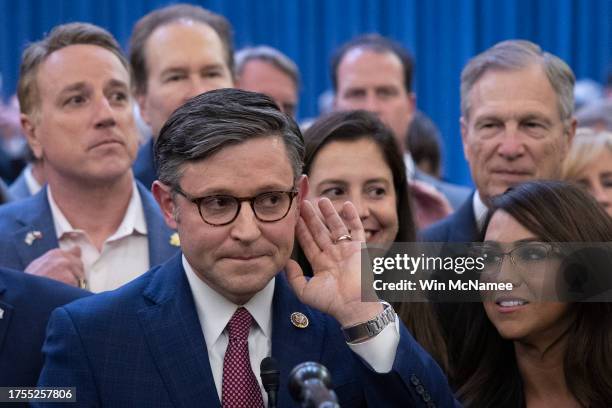 Rep. Mike Johnson surrounded by House Republicans speaks after being elected as the speaker nominee during a GOP conference meeting in the Longworth...