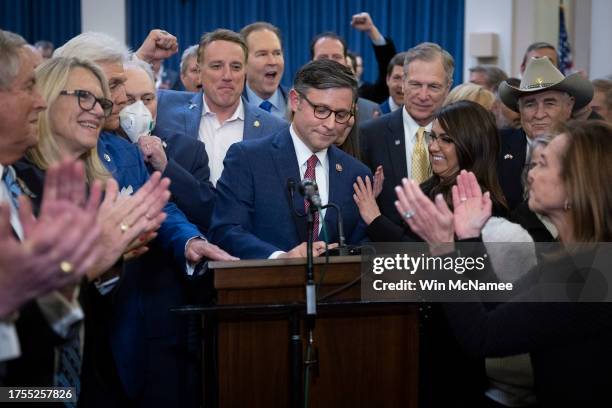Rep. Mike Johnson surrounded by House Republicans speaks after being elected as the speaker nominee during a GOP conference meeting in the Longworth...
