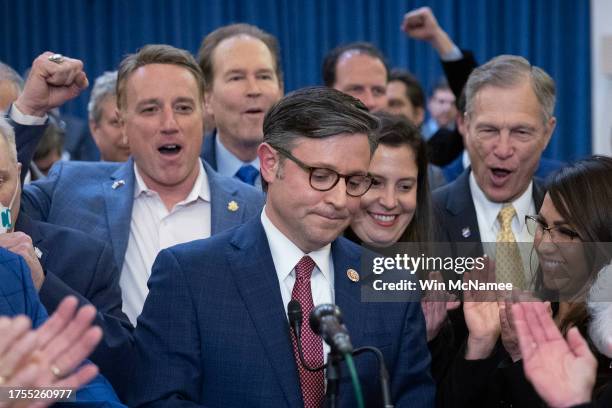Rep. Mike Johnson surrounded by cheering House Republicans speaks after being elected as the speaker nominee during a GOP conference meeting in the...