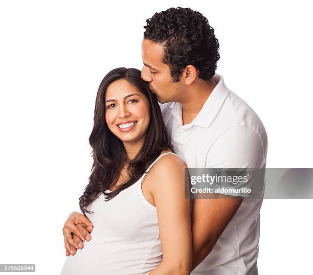 affectionate pregnant couple - belly kissing stockfoto's en -beelden