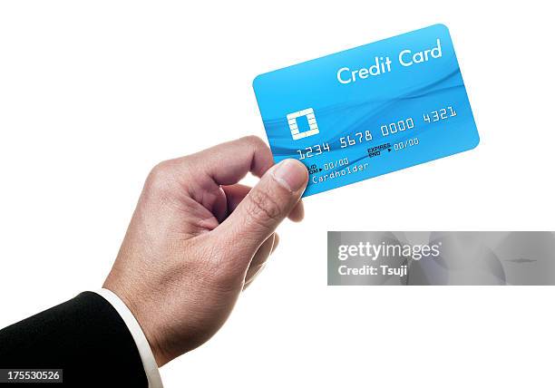 holding credit card - hand holding credit card stock pictures, royalty-free photos & images