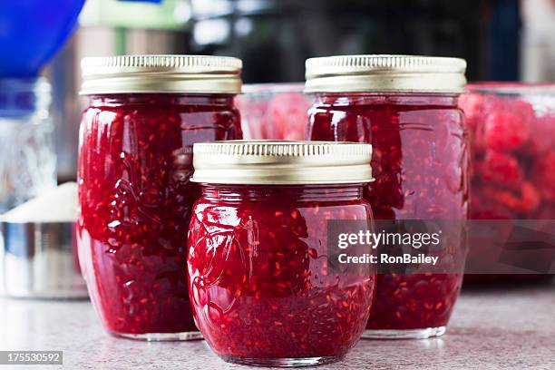 making raspberry jam - jam stock pictures, royalty-free photos & images