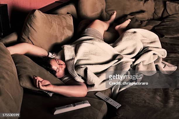 asleep on the couch - coma stock pictures, royalty-free photos & images