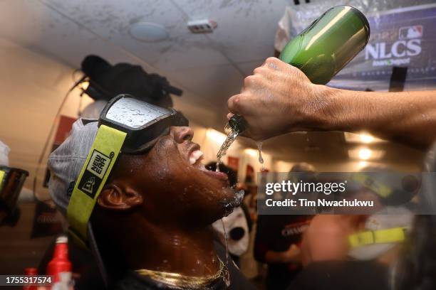 Geraldo Perdomo of the Arizona Diamondbacks celebrates in the clubhouse after beating the Philadelphia Phillies 4-2 in Game Seven of the Championship...