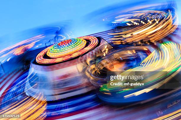 long exposure photo of carnival rides - fairground ride stock pictures, royalty-free photos & images