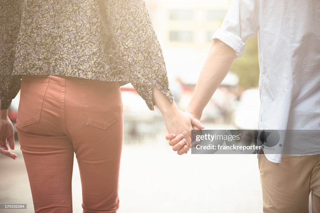 Holding hands, caucasian couple in love