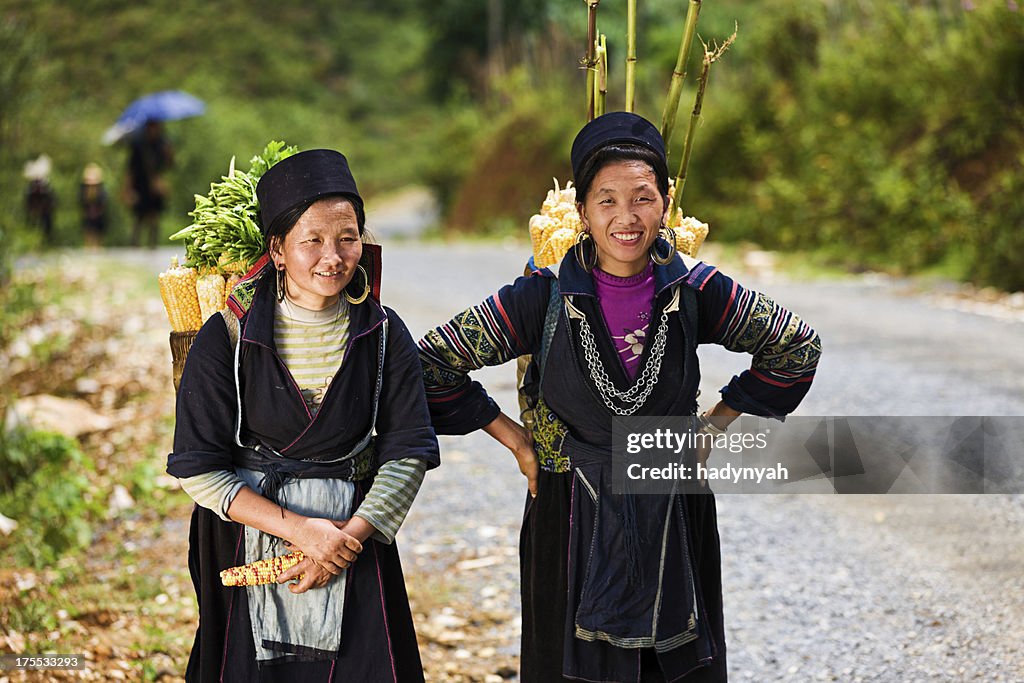 Vietnamese women carrying corn near Sapa town