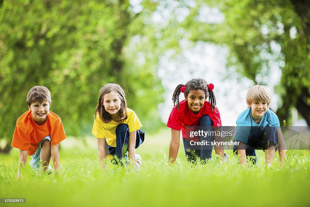 Cheerful kids doing stretching exercises.