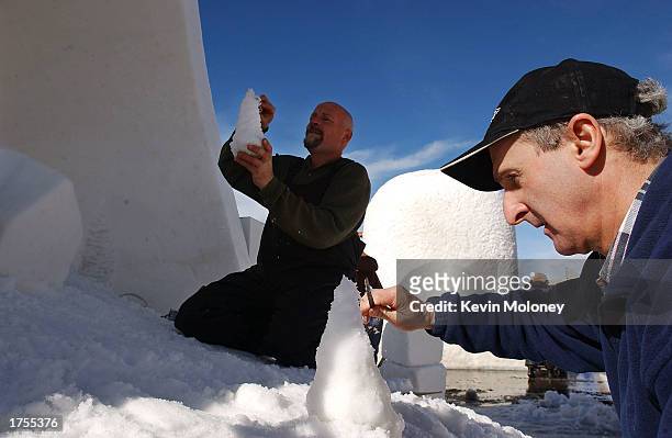Denis Kleine and Carl Schlichting carve tiny trees at the 13th annual International Snow Sculpture Championship January 31, 2003 in Breckenridge,...