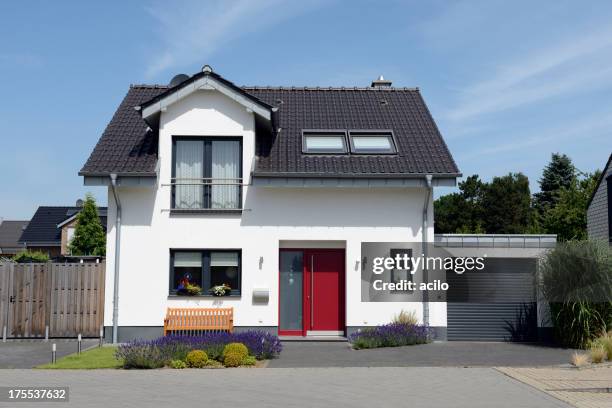 view of white house with garage from the front - german house exterior stock pictures, royalty-free photos & images