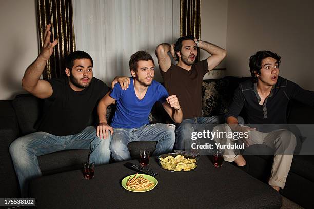 young men watching sports competition - hockey championship stock pictures, royalty-free photos & images