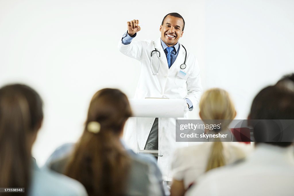 Doctor giving a speech on  seminar.