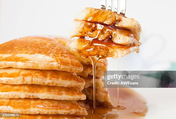 fork in pancakes - maple syrup pancakes stock pictures, royalty-free photos & images