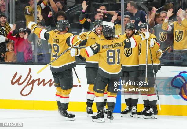 Shea Theodore of the Vegas Golden Knights celebrates with teammates after scoring the game-winning goal during the third period against the...