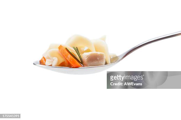 spoonful of chicken noodle soup - chicken soup stock pictures, royalty-free photos & images