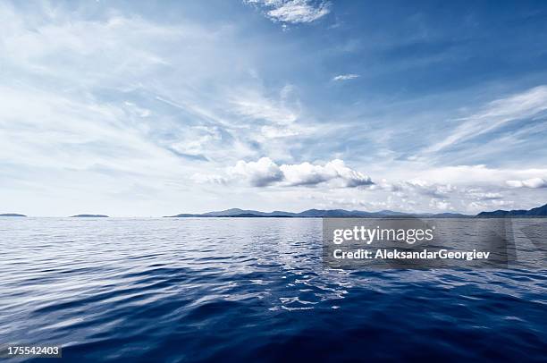 deep blue ocean - sunset over beach stock pictures, royalty-free photos & images