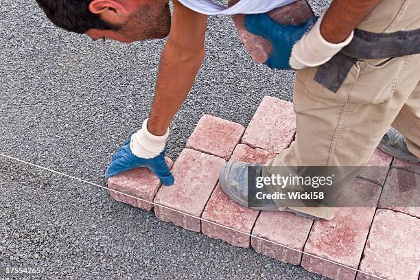 paver at work - mason bricklayer stock pictures, royalty-free photos & images