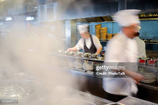 many busy chefs working in kitchen - xxxlarge - catering stockfoto's en -beelden