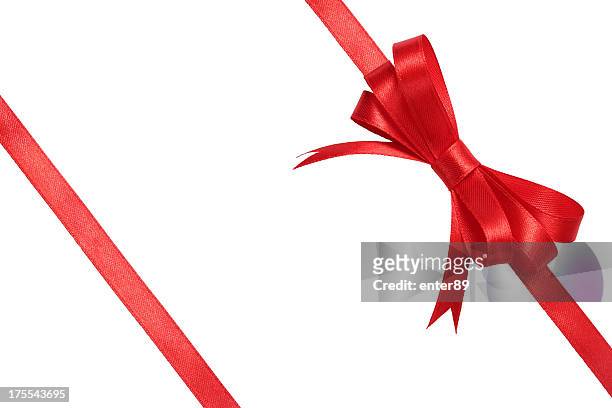 red bow wrapped around white background - satin stock pictures, royalty-free photos & images