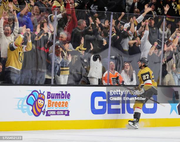 Shea Theodore of the Vegas Golden Knights celebrates his third-period goal against the Philadelphia Flyers with less than a minute remaining in their...