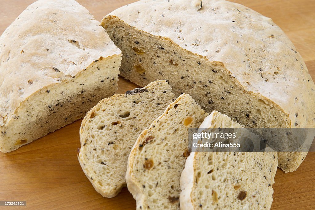 Slices of homemade round loaf, rosemary bread