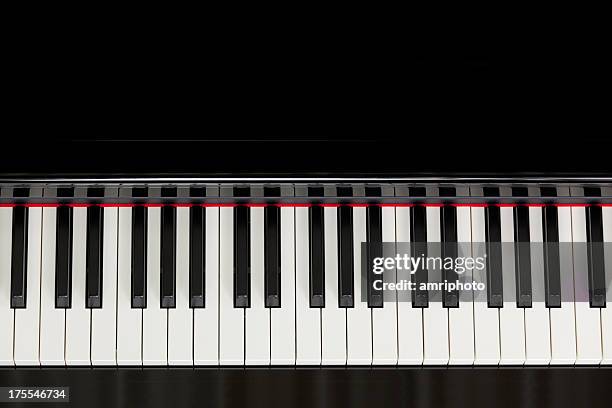 top view black piano keyboard - klavier stockfoto's en -beelden