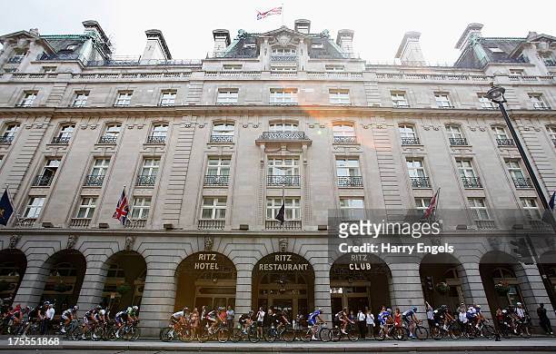 The peloton cycles past the Ritz Hotel during the Prudential RideLondon-Surrey Classic on August 4, 2013 in London, England.