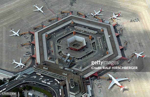 An aerial view shows planes of German airline companies Lufthansa and Air Berlin parked at Tegel Airport in Berlin, Germany on August 1, 2013. AFP...