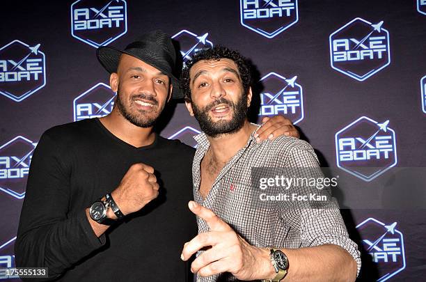 Kickboxer Cyrille Diabate and comedian Ramzy Bedia attend the Axe Boat 2013 Launch Party at Cannes Harbourg on August 3, 2013 in Saint Tropez, France.