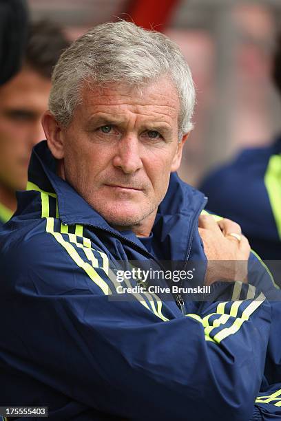 Stoke City manager Mark Hughes watches his new team during the pre season friendly match between Wrexham AFC and Stoke City at Racecourse Ground on...