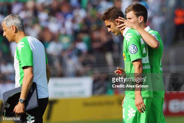 Branimir Hrgota of Moenchengladbach is comforted by team mate Havard Nordtveit after he missed the final penalty during the penalty shoot-out of the...