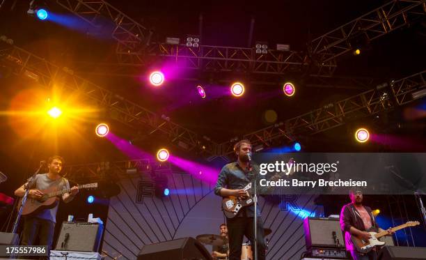 Band members of Frightened Rabbit perform during Lollapalooza 2013 at Grant Park on August 2, 2013 in Chicago, Illinois.