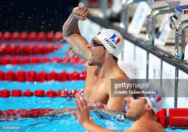 Camille Lacourt and Jeremy Stravius of France celebrate after the Swimming Men's Backstroke 50m Final on day sixteen of the 15th FINA World...