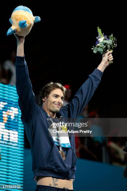 Gold medal winner Camille Lacourt of France celebrates on the podium after the Men's Backstroke 50m Final on day sixteen of the 15th FINA World...