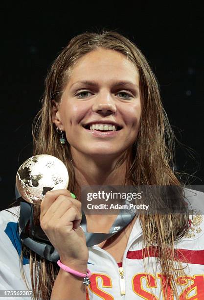 Gold medal winner Yuliya Efimova of Russia celebrates on the podium after the Swimming Women's Breaststroke 50m Final on day sixteen of the 15th FINA...