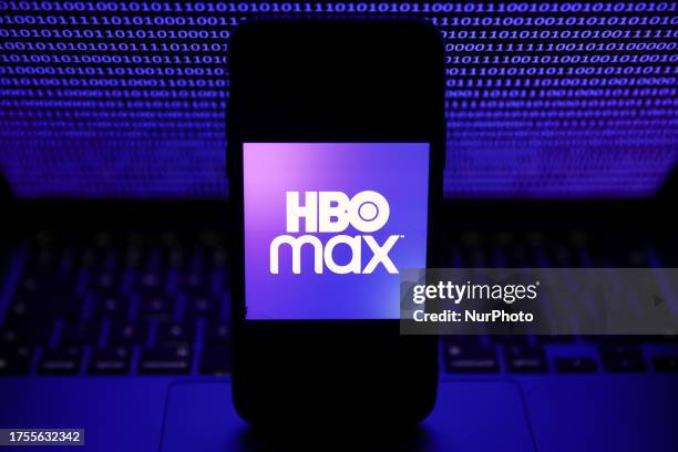 Binardy code displayed on a laptop screen and HBO Max logo displayed on a phone screen are seen in this illustration photo taken in Krakow, Poland on...