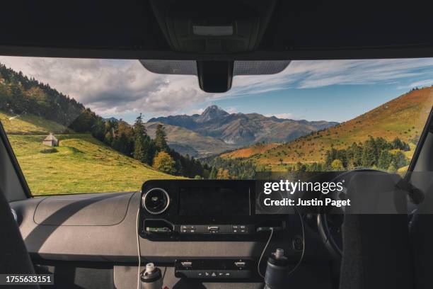view of the pyrenees mountains through the windscreen of a campervan - windschutzscheibe innen stock-fotos und bilder