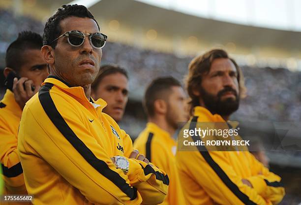 Carlos Tevez and Andrea Pirlo of Juventus watch the Real Madrid vs Everton Match before the Juventus vs Los Angeles Galaxy match at the 2013 Guinness...