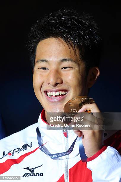 Gold medal winner Daiya Seto of Japan celebrates on the podium after the Swimming Men's Medley 400m Final on day sixteen of the 15th FINA World...