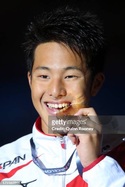 Gold medal winner Daiya Seto of Japan celebrates on the podium after the Swimming Men's Medley 400m Final on day sixteen of the 15th FINA World...