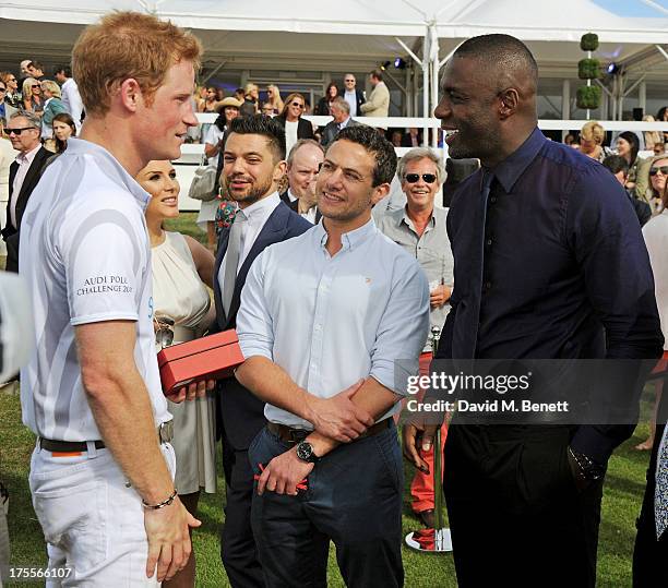 Prince Harry, Tonya Meli, Dominic Cooper, Warren Brown and Idris Elba attend day 2 of the Audi Polo Challenge at Coworth Park Polo Club on August 4,...