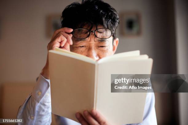 japanese man with poor sight - poor eyesight stock pictures, royalty-free photos & images