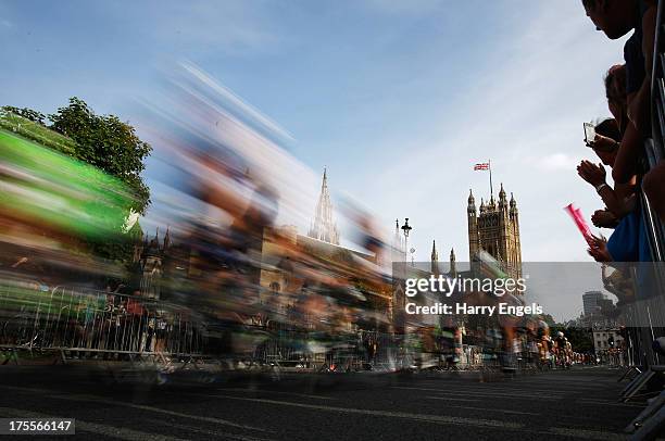 The peloton passes the Houses of Parliament during the Prudential RideLondon-Surrey Classic on August 4, 2013 in London, England.