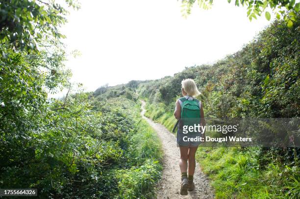 walking a countryside path - white shorts stock pictures, royalty-free photos & images