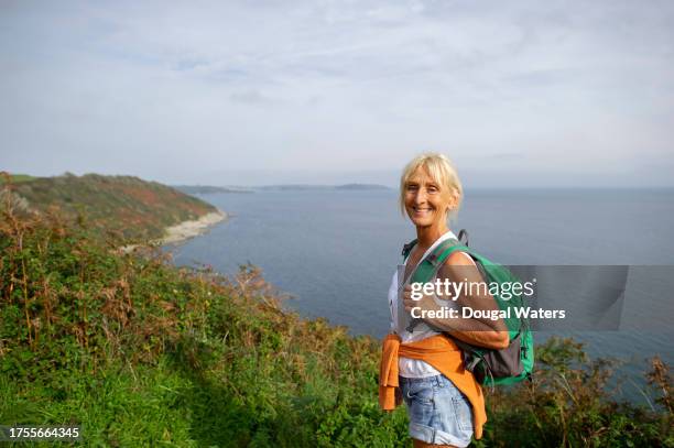 hiking by the sea - white shorts stock pictures, royalty-free photos & images