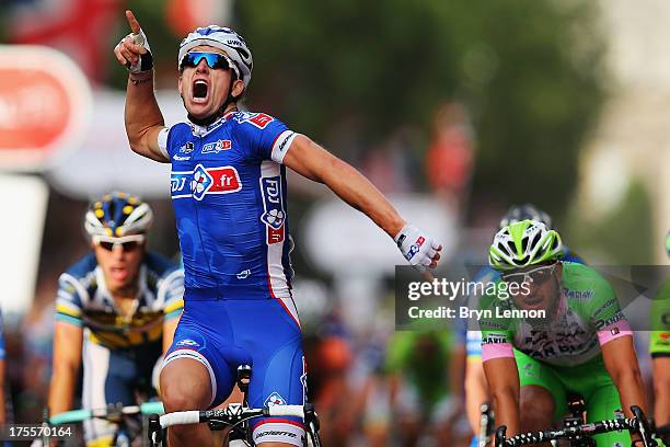 Arnaud Demare of France and FDJ crosses the finish line to win the London - Surrey Classic from the Queen Elizabeth Olympic Park to The Mall on...