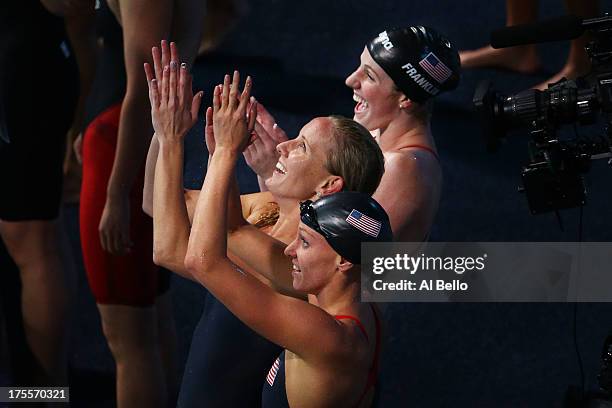 Missy Franklin of the USA celebrates with teammates Dana Vollmer and Jessica Hardy after the Swimming Women's Medley 4x100m Relay Final on day...