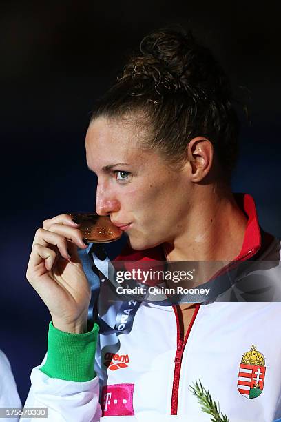 Gold medal winner Katinka Hosszu of Hungary celebrates on the podium after the Swimming Women's Individual Medley 400m Final on day sixteen of the...