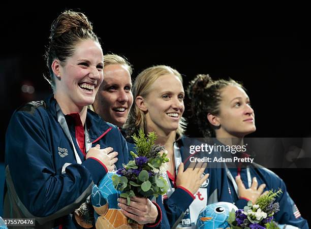 Gold medal winners Missy Franklin, Jessica Hardy, Dana Vollmer and Megan Romano of the USA celebrate on the podium after the Swimming Women's Medley...