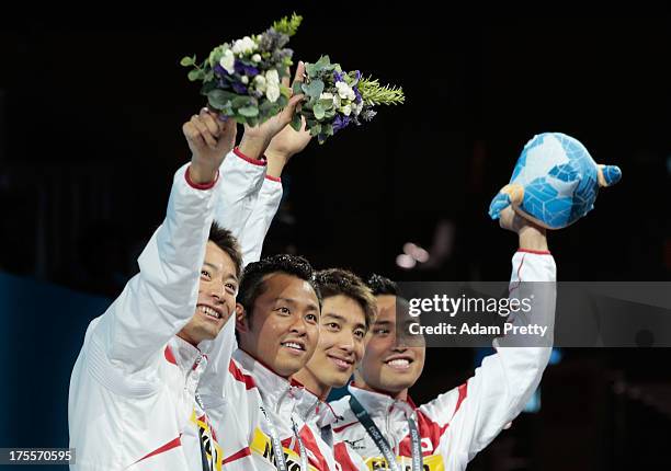 Bronze medal winners Ryosuke Irie, Kosuke Kitajima, Takuro Fujii and Shinri Shioura of Japan celebrate on the podium after the Swimming Men's Medley...